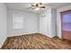 Spacious bedroom boasts wood floors, a ceiling fan, and ample natural light at 1747 Parkhill Dr, Decatur, GA 30032