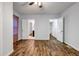 Bedroom features wood floors, neutral walls, and multiple doorways for easy access at 1747 Parkhill Dr, Decatur, GA 30032