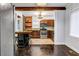 Eat-in kitchen featuring an island with seating, stainless steel appliances, and wood cabinets at 1747 Parkhill Dr, Decatur, GA 30032
