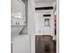 Laundry room with a stacked washer and dryer and view of living room at 1747 Parkhill Dr, Decatur, GA 30032