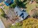 This angle shows the roof, yard and nearby homes in a well-established neighborhood at 210 Timber Laurel Ct, Lawrenceville, GA 30043