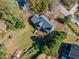 Overhead shot of the property, displaying the expansive backyard and surrounding greenery at 210 Timber Laurel Ct, Lawrenceville, GA 30043