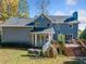 View of the back of the house featuring large deck and lush landscaping at 210 Timber Laurel Ct, Lawrenceville, GA 30043