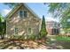 Back exterior view of the home features screened-in porch at 3134 Hudson Pond Ln, Marietta, GA 30062