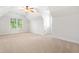 Upstairs bonus room with neutral carpet and natural light at 3134 Hudson Pond Ln, Marietta, GA 30062