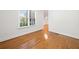 Brightly lit room with a large window and gleaming hardwood floors at 3134 Hudson Pond Ln, Marietta, GA 30062
