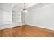 Spacious living room featuring built-in shelving and hardwood floors at 3134 Hudson Pond Ln, Marietta, GA 30062