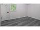 This bedroom features hardwood floors, fresh paint and a window view at 3570 Briar Dr, Lithia Springs, GA 30122