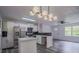Renovated kitchen with white cabinets, stainless appliances, and island at 3570 Briar Dr, Lithia Springs, GA 30122