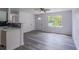 Bright living room with modern floors, large window and an open floor plan at 3570 Briar Dr, Lithia Springs, GA 30122