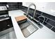 Modern kitchen sink with sleek faucet, cutting board, and white countertops at 3570 Briar Dr, Lithia Springs, GA 30122