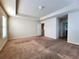 Bedroom with carpet flooring, two doors, and large windows for natural lighting at 5150 Amberland Sq, Atlanta, GA 30349