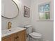 Elegant half bathroom featuring a modern vanity and stylish mirror at 1863 Wicks Valley Ne Dr, Marietta, GA 30062
