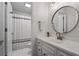 This bright bathroom offers a large vanity and sink, modern fixtures, and a shower and tub combo at 1863 Wicks Valley Ne Dr, Marietta, GA 30062
