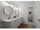 Elegant bathroom featuring double sinks, stylish mirrors, and plenty of counter space at 1863 Wicks Valley Ne Dr, Marietta, GA 30062