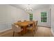 Formal dining room with natural light, hardwood floors, and stylish lighting at 1863 Wicks Valley Ne Dr, Marietta, GA 30062