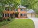 Beautiful brick home with black shutters and a well-manicured lawn at 1863 Wicks Valley Ne Dr, Marietta, GA 30062