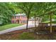 Charming two-story brick home with a three-car garage and a welcoming swing set at 1863 Wicks Valley Ne Dr, Marietta, GA 30062