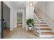 Inviting foyer with wood floors, a staircase, and a view to the outside at 1863 Wicks Valley Ne Dr, Marietta, GA 30062
