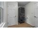 This laundry room features a stackable washer and dryer, door to the outside, and hard surface floors at 1863 Wicks Valley Ne Dr, Marietta, GA 30062