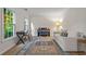 Bright living room with a piano, desk, and comfortable seating area at 1863 Wicks Valley Ne Dr, Marietta, GA 30062