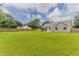A large backyard offers plenty of space for outdoor living, recreation, and gardening at 250 Meadow View Dr, Grayson, GA 30017