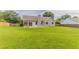 Large backyard featuring lush green grass, partial fencing, and ample space for recreation at 250 Meadow View Dr, Grayson, GA 30017