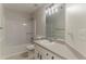 Clean bathroom featuring a tub, toilet, and single sink vanity with a mirror at 250 Meadow View Dr, Grayson, GA 30017