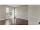 Bright bedroom featuring hardwood floors, large windows, and decorative trim at 250 Meadow View Dr, Grayson, GA 30017