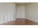 Bedroom with hardwood floors featuring a double closet for ample storage at 250 Meadow View Dr, Grayson, GA 30017