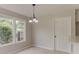 Cozy dining area featuring wood-look floors and a modern chandelier at 250 Meadow View Dr, Grayson, GA 30017
