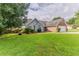 Charming single Gathering home featuring a brick facade, attached garage, and a well-manicured front lawn at 250 Meadow View Dr, Grayson, GA 30017