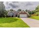 Charming single Gathering home featuring a brick facade, attached garage, and a well-manicured front lawn at 250 Meadow View Dr, Grayson, GA 30017