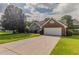 Single Gathering home featuring a brick facade, attached garage, and a well-manicured front lawn at 250 Meadow View Dr, Grayson, GA 30017