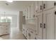 Bright kitchen featuring white cabinets, modern hardware, and ample countertop space at 250 Meadow View Dr, Grayson, GA 30017