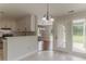 Bright, open kitchen/dining area with stainless steel appliances and natural light at 250 Meadow View Dr, Grayson, GA 30017