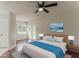 Cozy main bedroom featuring a ceiling fan, french doors, and an ensuite bathroom at 250 Meadow View Dr, Grayson, GA 30017