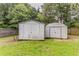 Two storage sheds in backyard offer ample space for gardening tools and outdoor equipment at 250 Meadow View Dr, Grayson, GA 30017