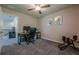 Bedroom featuring neutral paint, carpeted floors, ceiling fan and a doorway to another space at 3291 Wild Basil Ln, Buford, GA 30519