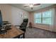 Bedroom featuring a ceiling fan, neutral paint, carpeted floors and a large window at 3291 Wild Basil Ln, Buford, GA 30519
