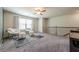 Bonus room featuring neutral paint, carpeted floors and a large window at 3291 Wild Basil Ln, Buford, GA 30519
