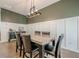 Bright dining area with modern light fixture and wainscoting details at 3291 Wild Basil Ln, Buford, GA 30519