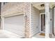 Close up of the front entrance of the home featuring house number and integrated doorbell at 3291 Wild Basil Ln, Buford, GA 30519