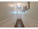Bright hallway with shiplap accent and views of the front door at 3291 Wild Basil Ln, Buford, GA 30519