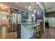 Open kitchen with stainless steel appliances, granite countertops, and a central island at 3291 Wild Basil Ln, Buford, GA 30519