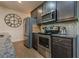 Close up of the kitchen area with stainless steel appliances and subway tile backsplash at 3291 Wild Basil Ln, Buford, GA 30519