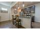 Kitchen with large island and stainless appliances including refrigerator, oven, and microwave at 3291 Wild Basil Ln, Buford, GA 30519