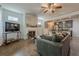 Open-concept living space with fireplace flowing into the kitchen area at 3291 Wild Basil Ln, Buford, GA 30519