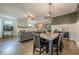 Open concept living space with fireplace flowing into the dining room and kitchen at 3291 Wild Basil Ln, Buford, GA 30519