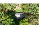 Aerial view of home nestled among lush trees and greenery at 6896 Heardsville Rd, Cumming, GA 30028